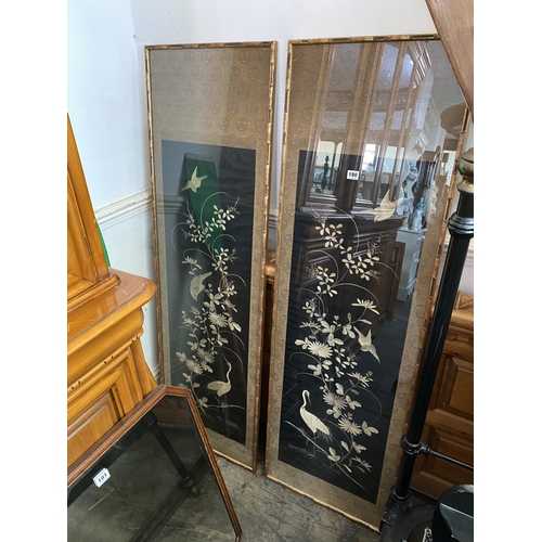 180 - 2 framed embroidered silk panels depicting foliage and birds, both in bamboo style frames