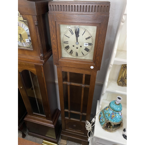 194 - An oak cased long case clock with silver dial