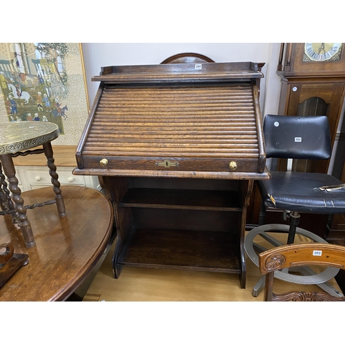 204 - An oak roll top desk of small proportions