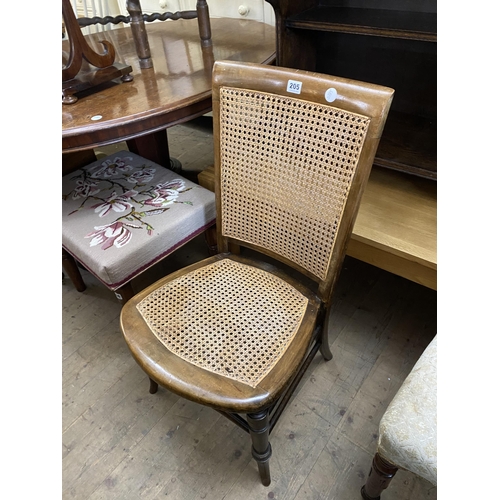 205 - A low chair with split cane seat and back