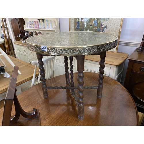 209 - A brass topped benares style table