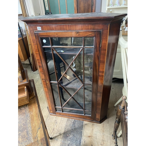 218 - A Georgian mahogany astragal glazed corner cabinet with canted corners