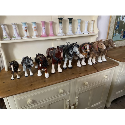 219 - A collection of pottery cart horses