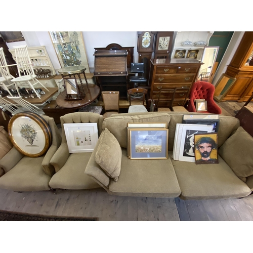 231 - A good quality settee with matching armchairs on mahogany legs with brass casters