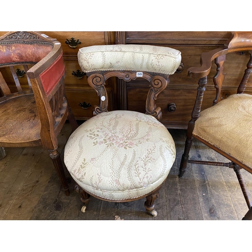 245 - A Victorian walnut nursing chair with an upholstered top rail and seat, finishing on brass and porce... 