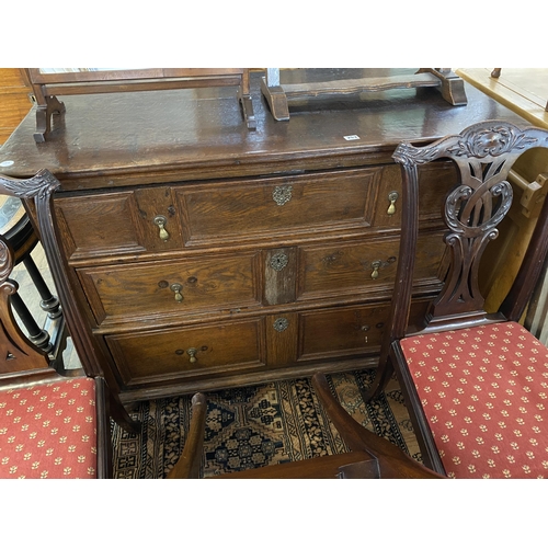 253 - A heavy elm chest of 3 graduated drawers, each with panelled detail