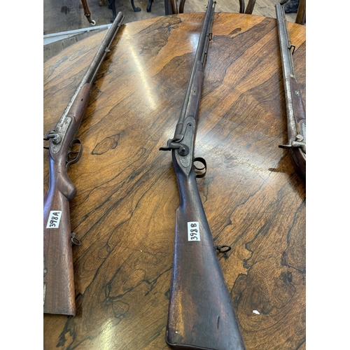 398b - A 19th century percussion musket, the barrel with decoration and a slightly flared end