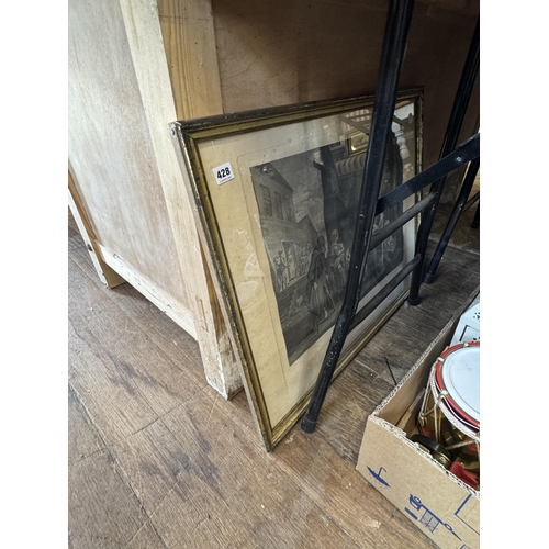 428 - A framed print of a French scene