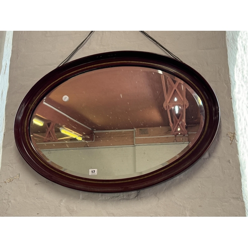 17 - A mahogany framed oval mirror