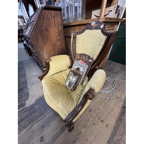 186 - An Edwardian inlaid shield shaped backed armchair (for restoration)