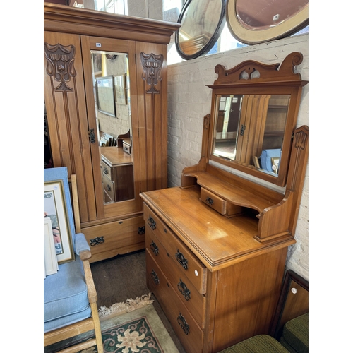 19 - A mirrored wardrobe and mirror backed dressing chest in art nouveau style