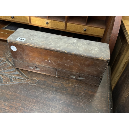 194 - A pine box with drawers and a hinged lid