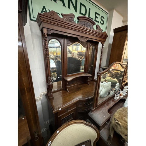 203 - An Edwardian mahogany mirror backed dresser with carved detail, turned pillars, decorative pediment,... 