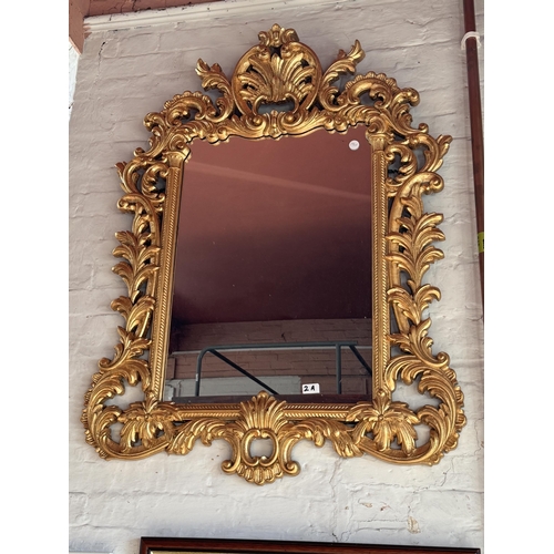 2a - A reproduction Georgian style ornate framed wall mirror with scroll and acanthus decoration