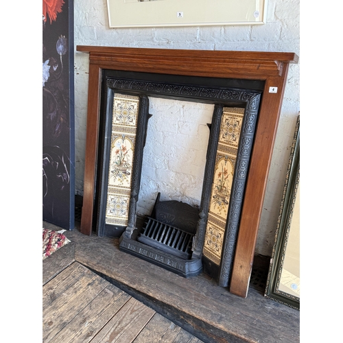 4 - A Victorian cast iron and tiled fireplace with wooden mantelpiece