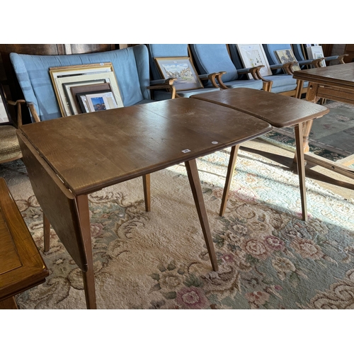 45 - A drop leaf Ercol kitchen table with separate extender table