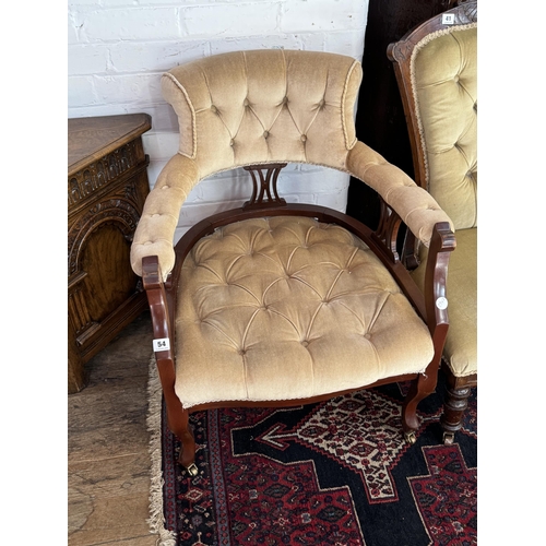 54 - An Edwardian button upholstered armchair