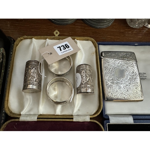 736 - 2 silver napkin rings, a silver cigarette case and 2 salt pots