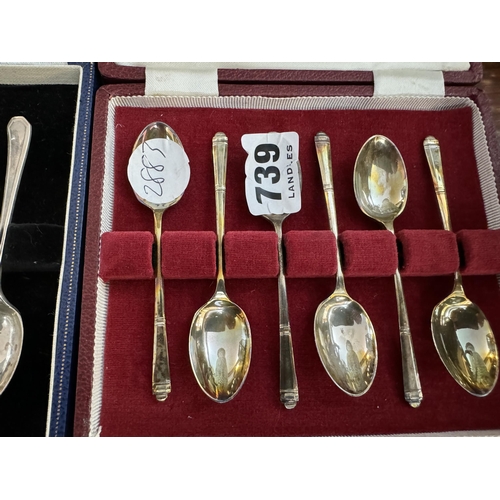 739 - A boxed set of 4 silver coffee spoons