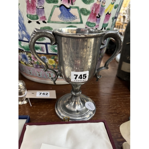 745 - A twin handled presentation trophy cup