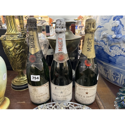 754 - 3 vintage bottles of Moet & Chandon champagne