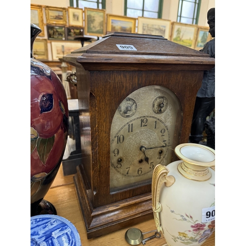 905 - An oak cased bracket clock with a silver dial, subsidiary dials for speed and silent chime