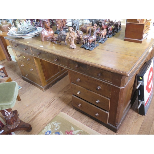 70 - An early 20th century oak partner's desk, one side with three frieze drawers over three drawers in e... 