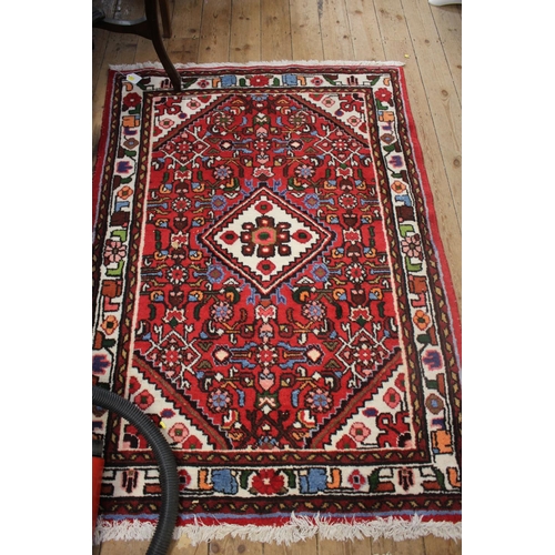 111 - An Heriz style Louis De Poortere rug, 167 x 91 cm, and another similar rug, 150 x 100 cm (2)