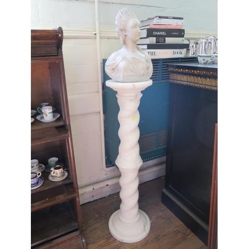 187 - A 19th century marble bust of Marie Antoinette, 35 cm high, on a later alabaster barley twist column... 