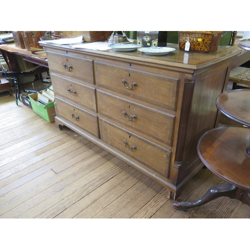 65 - A George III oak and mahogany crossbanded Lancashire mule chest, the hinged top over four short dumm... 