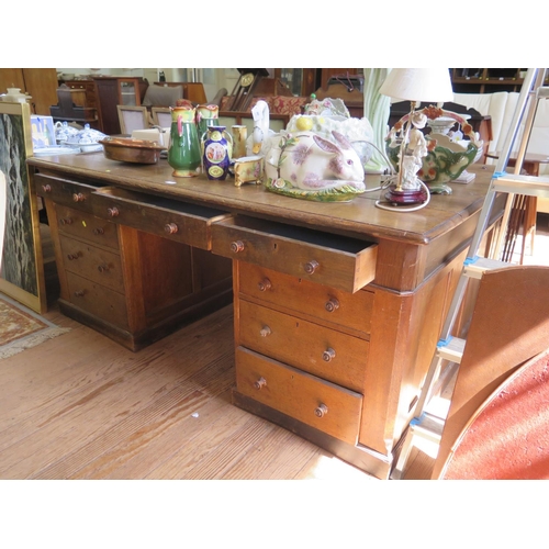 70 - An early 20th century oak partner's desk, one side with three frieze drawers over three drawers in e... 