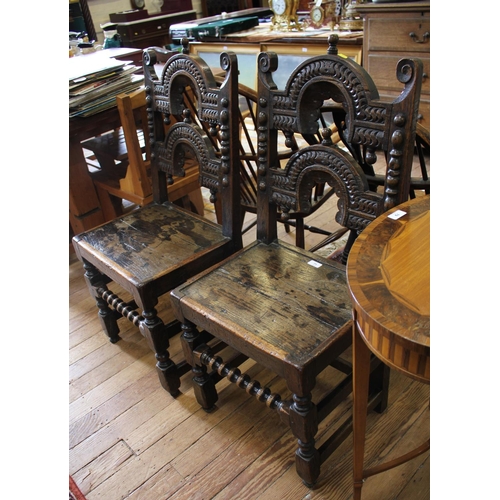 71 - A pair of Yorkshire or Derbyshire backstool chairs, carved arched back rails with pendants over soli... 