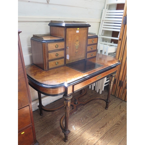 76 - A late Victorian French style satinwood and inlaid writing desk, the top with central urn inlaid cup... 