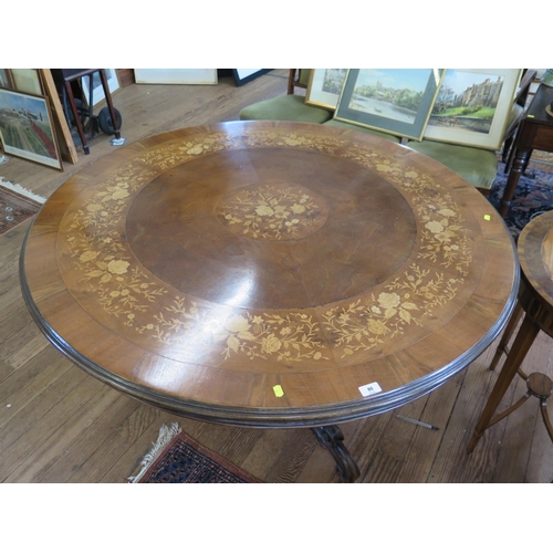 80 - A Victorian walnut snap top centre table, the Italian marquetry inlaid top with floral decoration on... 