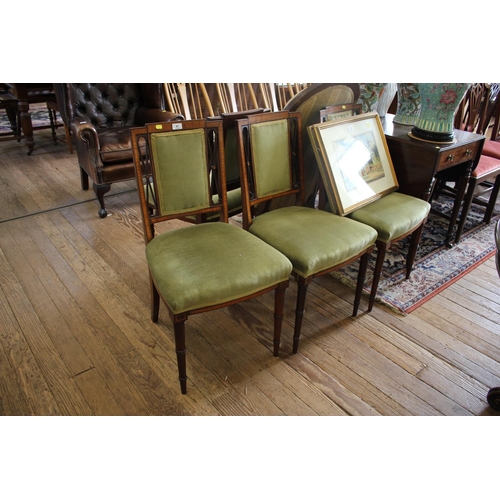 81 - A set of four Edwardian mahogany and satinwood crossbanded dining chairs, the rectangular upholstere... 