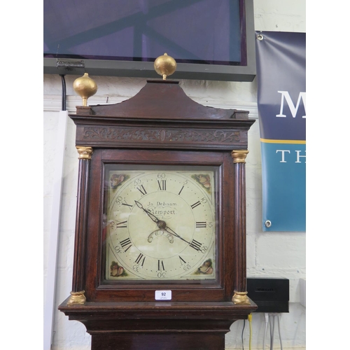 92 - An early 19th century oak longcase clock, with gilded finials over blind fret carved frieze, the she... 