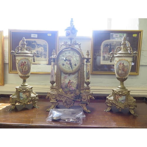 97 - A French 19th century style clock garniture with porcelain panels, depicting Napoleonic figures, the... 