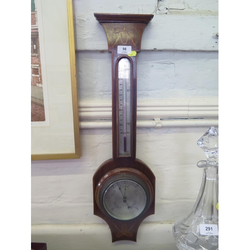 98 - An Edwardian inlaid mahogany barometer, with thermometer and silvered dial, 68 cm high