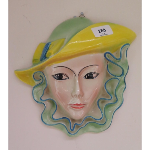 288 - A Shorter and Son Pottery wall mask of a young lady wearing bright green and yellow hat