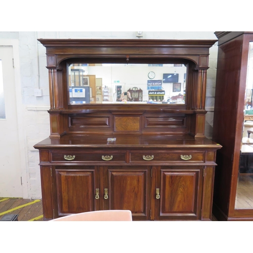 3 - An Edwardian walnut mirror back sideboard, the moulded cornice over twin column supports and shelves... 