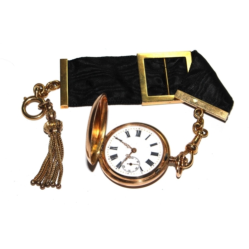 519 - A ladies 14 carat gold fob watch attached to an 18 carat gold and ribbon fob