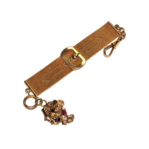 520 - A gold colour metal Milanese watch fob attached to a rough piece of gold colour metal