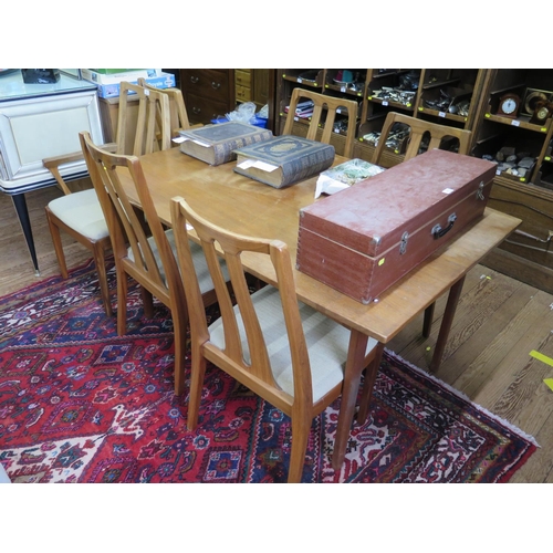 9 - A set of six teak dining chairs by Nathan, including two carvers, with open splat backs, and a teak ... 