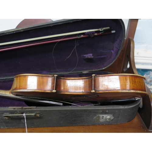 252 - A 20th century German violin
labelled 'Copy of Antonio Stradivarius', length of the two piece back 3... 