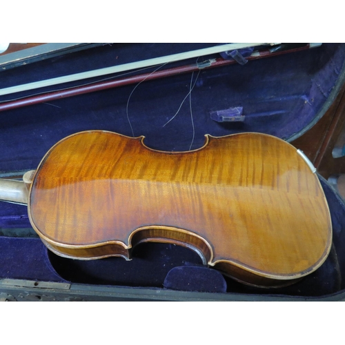 252 - A 20th century German violin
labelled 'Copy of Antonio Stradivarius', length of the two piece back 3... 