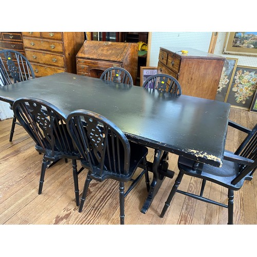 26 - An Ebonised Dining Table and Six Chairs. 20th century.
74cm x 179cm x 90cm