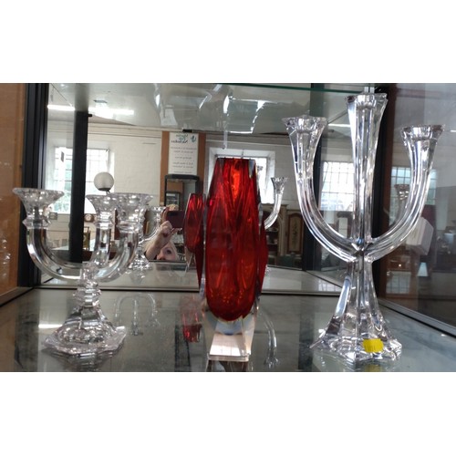 231 - Two Villery & Boch three-branch glass candle holders 30cm and 16.5cm; and red and clear faceted vase... 