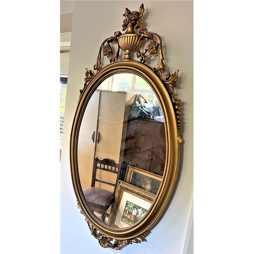 60 - A Gilt Plaster Framed Wall Mirror.