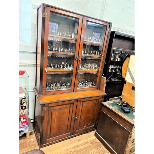 61 - A Late Victorian Glazed Bookcase. Circa 1870.