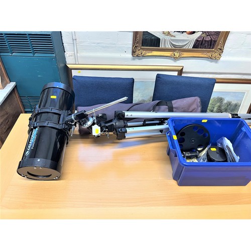 A Celestron 21049 PowerSeeker 127EQ Reflector Telescope, together with